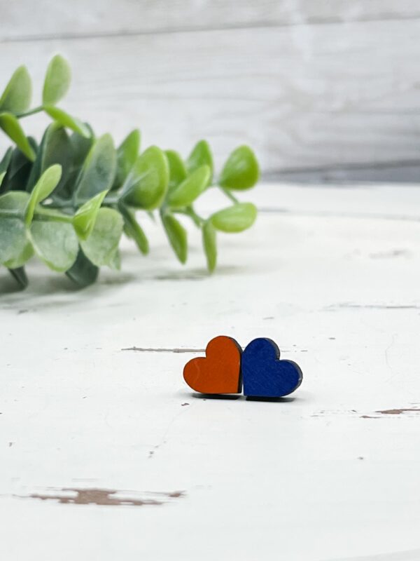Hand-painted wooden heart stud earrings. Measures roughly .43x.4. Lightweight earrings secured with nickel-free hardware.
